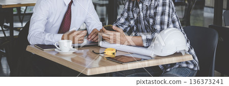 Banner Contractor construction engineer meeting on architect table at construction site. Businessman engineer manager discuss talk together foreman team builder using measure tape with copy space Banner Contractor construction engineer meeting on architect table at construction site. Businessman engineer manager discuss talk together foreman team builder using measure tape with copy space 136373241