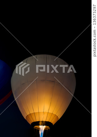 colorful hot air balloons glowing against the night sky colorful hot air balloons glowing against the night sky 136373297
