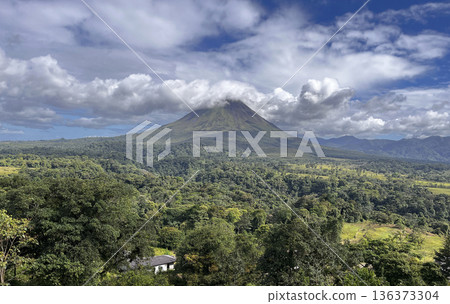 Arenal Volcano surrounded by beautiful clouds in Costa Rica Arenal Volcano surrounded by beautiful clouds in Costa Rica 136373304