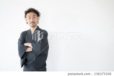 The upper body of a middle-aged man with a beard wearing a yukata on a white background The upper body of a middle-aged man with a beard wearing a yukata on a white background 136375208