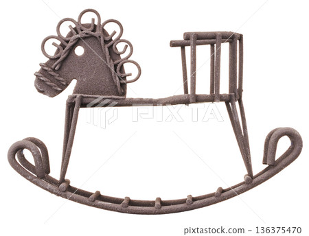 An antique brown rocking horse (iron object) cut out on a white background An antique brown rocking horse (iron object) cut out on a white background 136375470
