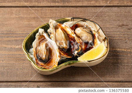 Grilled oysters: A fragrantly grilled winter seafood dish Grilled oysters: A fragrantly grilled winter seafood dish 136375580