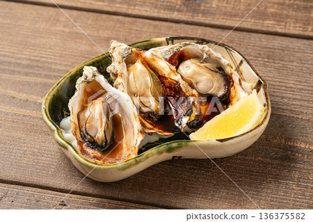 Grilled oysters: A fragrantly grilled winter seafood dish Grilled oysters: A fragrantly grilled winter seafood dish 136375582