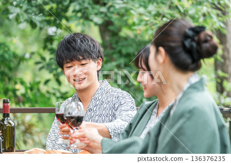 Young men and women visiting a ryokan or hot spring inn (company trip, travel) 136376235