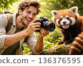 Man taking pictures of animals 136376595
