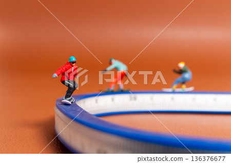 Snowboarding Balance and Challenge Symbolized by Measuring Tape 136376677
