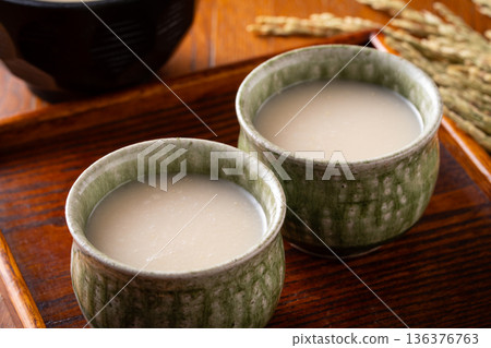 Drinking amazake Drinking amazake 136376763