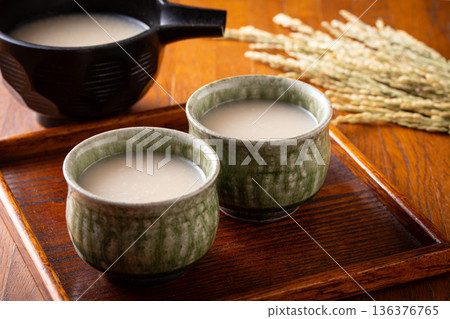 Drinking amazake 136376765