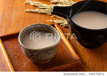 Drinking amazake 136376872