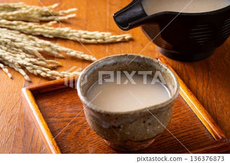 Drinking amazake Drinking amazake 136376873