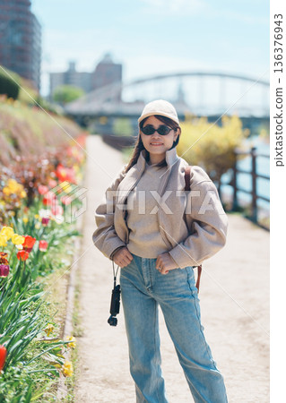 Woman tourist sightseeing Iwate mountain and Kitakami river with flowers in Spring, happy traveler travel in Morioka city, Iwate prefecture, Japan. famous Landmark Travel and Vacation destination Woman tourist sightseeing Iwate mountain and Kitakami river with flowers in Spring, happy traveler travel in Morioka city, Iwate prefecture, Japan. famous Landmark Travel and Vacation destination 136376943