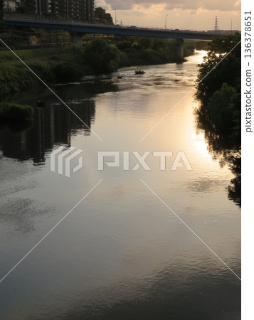 Sunsets reflected on the river Sunsets reflected on the river 136378651