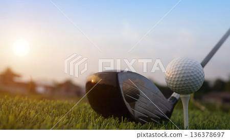 Golf clubs and balls on a green lawn in a beautiful golf course with morning sunshine. 136378697