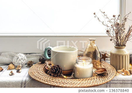 Cozy home composition with coffee cup and home decor details. Cozy home composition with coffee cup and home decor details. 136378840