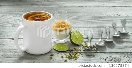 Cup of tea and spoons on a beautiful white wooden background, winter ,autumn 136378874