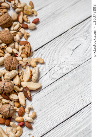 different nuts on white wooden background , 136378898
