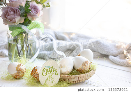 Easter composition with decorated eggs and flowers, copy space. 136378921