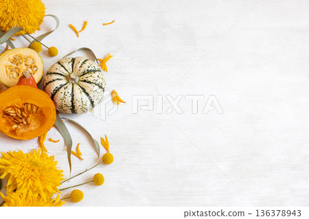 Autumn flat lay background with pumpkins and flowers, copy space. Autumn flat lay background with pumpkins and flowers, copy space. 136378943