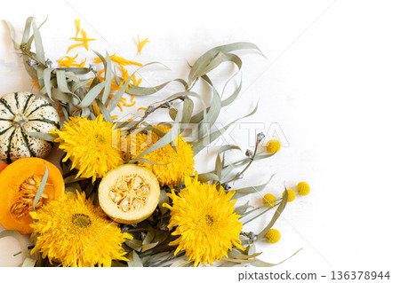 Autumn festive composition with flowers and pumpkins on a white background. Autumn festive composition with flowers and pumpkins on a white background. 136378944