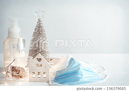 Christmas background with coronavirus personal protective equipment and decor details copy space. 136379085