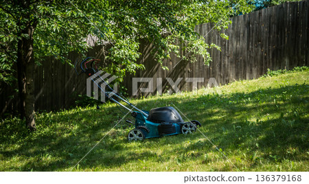 lawnmower on green grass lawnmower on green grass 136379168