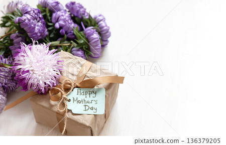Gift box with a wish for a happy mother's day on a white background, copy space. 136379205