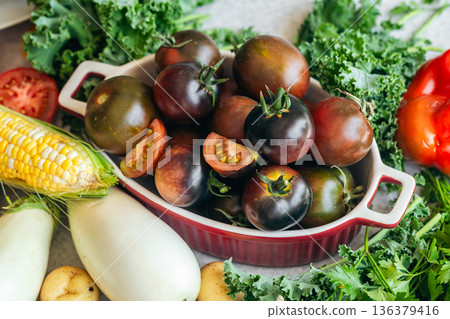 Background of vegetables and herbs on the kitchen table. Background of vegetables and herbs on the kitchen table. 136379416