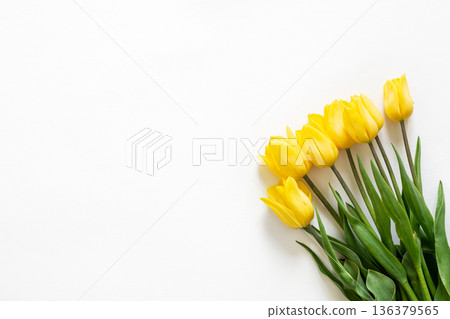 Bouquet of yellow tulips on a white background isolated, top view. 136379565