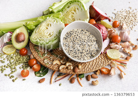 Close-up, a bowl of chia seeds and other healthy foods on the kitchen table. 136379653