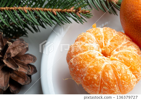 Close-up, tangerine without a peel on a plate. Close-up, tangerine without a peel on a plate. 136379727
