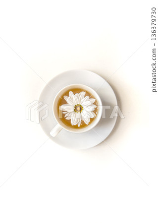 Close-up tea with chamomile flower isolated on white. 136379730