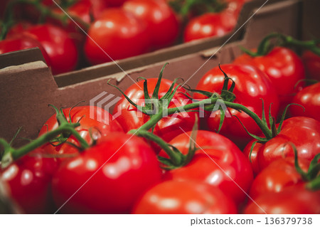 Close-up, tomatoes in a box on the counter. 136379738