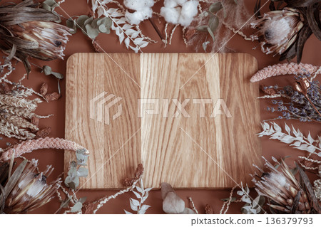 Floral arrangement with dry wildflowers and wooden element copy space. 136379793