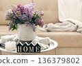 Composition with lilac flowers, candles and decorative word home. 136379802