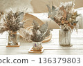 Composition with many dried flowers in vases . 136379803
