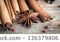 Composition with star anise and cinnamon sticks on a wooden background. 136379806