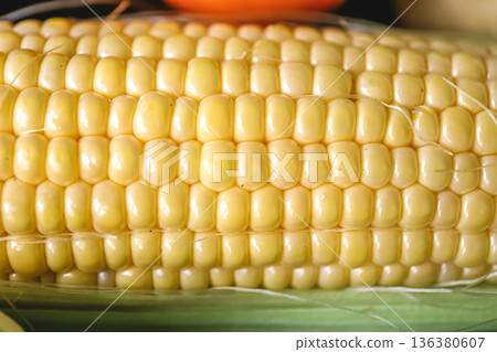 Natural background, fresh corn closeup, macro shot. Natural background, fresh corn closeup, macro shot. 136380607