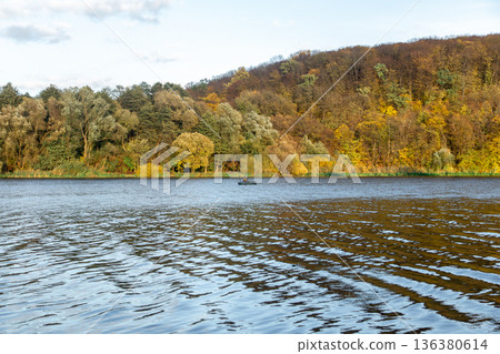 Natural background, wild nature, autumn forest by the lake. 136380614