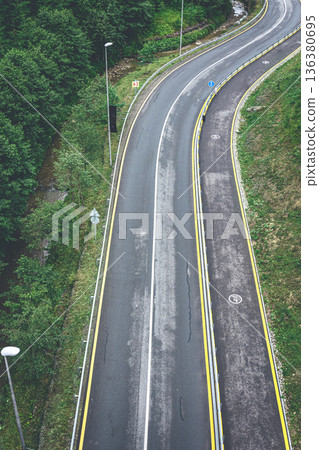 Winding road in the mountains, top view. Winding road in the mountains, top view. 136380695