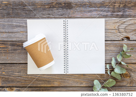 Paper disposable cup and notepad made from recycled paper cups, top view. Paper disposable cup and notepad made from recycled paper cups, top view. 136380752