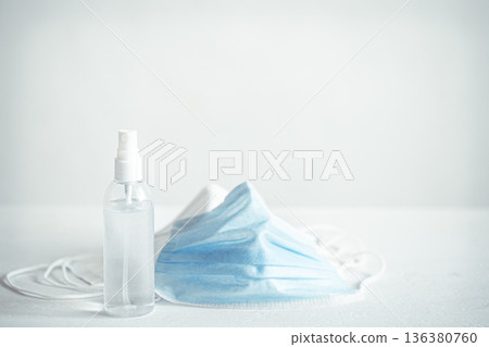 Coronavirus prevention hand sanitizer and protection face masks against coronavirus copy space. 136380760