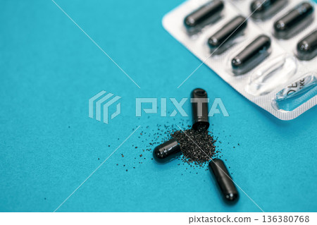 Pills on a blue background, close-up, medicine concept. Pills on a blue background, close-up, medicine concept. 136380768