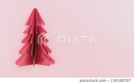 A pink paper origami christmas tree on pink background isolated, copy space. A pink paper origami christmas tree on pink background isolated, copy space. 136380787