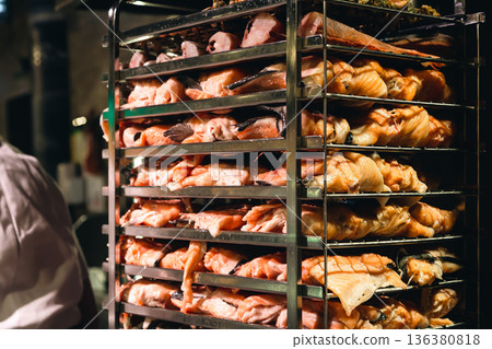 Racks of salmon smoking in a small smoker. Racks of salmon smoking in a small smoker. 136380818