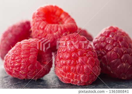 Ripe raspberries macro shot, selective focus, fruit background. Ripe raspberries macro shot, selective focus, fruit background. 136380841