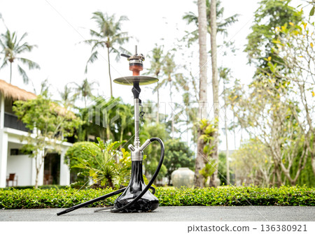 smoking hookah on vacation smoking hookah on vacation 136380921
