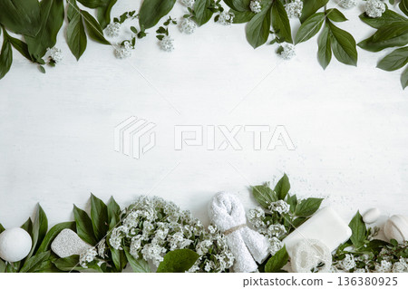 Spa composition with fresh flowers and body care products copy space. Spa composition with fresh flowers and body care products copy space. 136380925