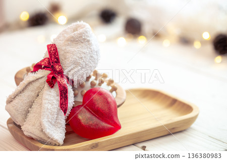 Spa composition with heart shaped soap towel close up. 136380983