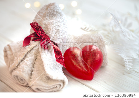 Spa composition with heart shaped soap towel close up. Spa composition with heart shaped soap towel close up. 136380984