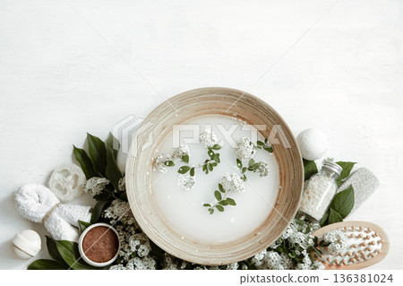 Spa composition with water for beauty treatments and fresh flowers. Spa composition with water for beauty treatments and fresh flowers. 136381024